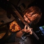 John of The Haemoglobins playing electric guitar