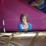 Linda playing the grand piano